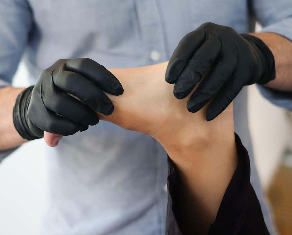 A dancer getting medical treatment on their foot due to a ballet injury