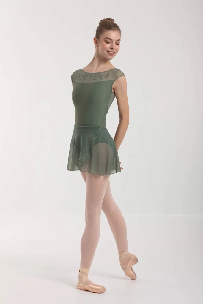 Female ballerina modelling a green wrap skirt