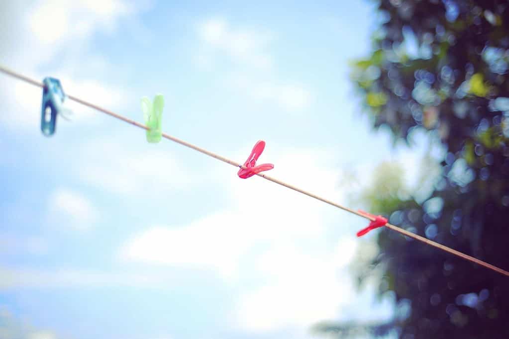 Clothes line with colourful pegs