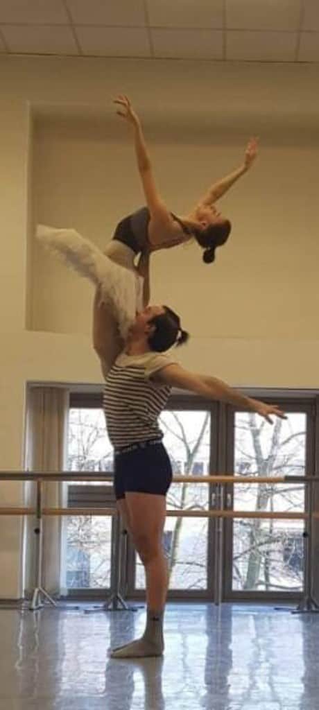 a male and female ballet dancer practicing a lift