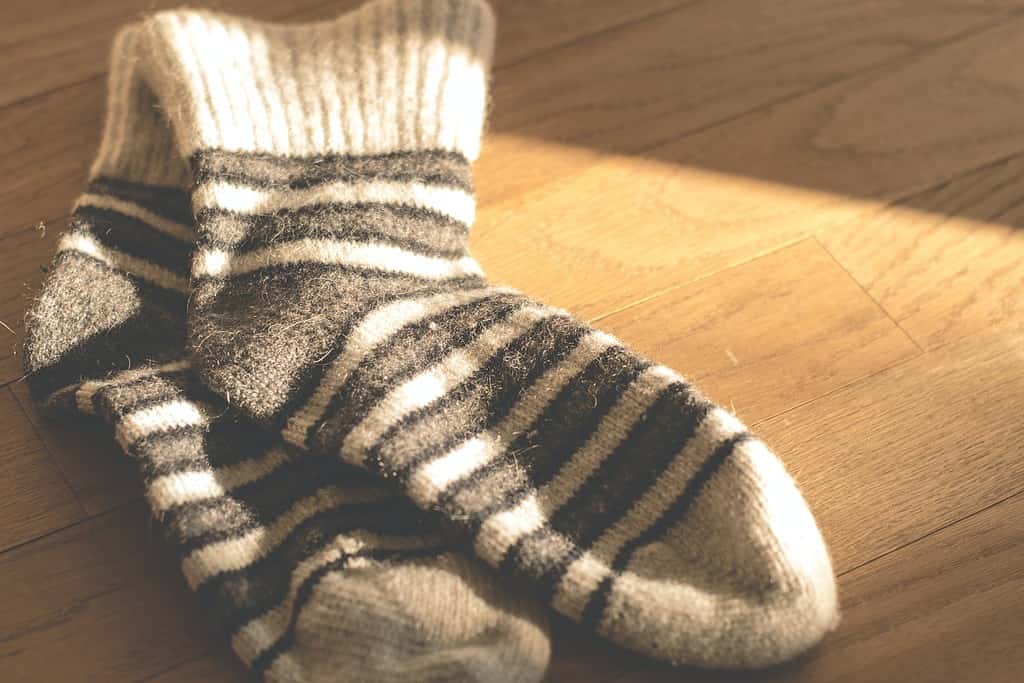 Stripey socks against wooden floor