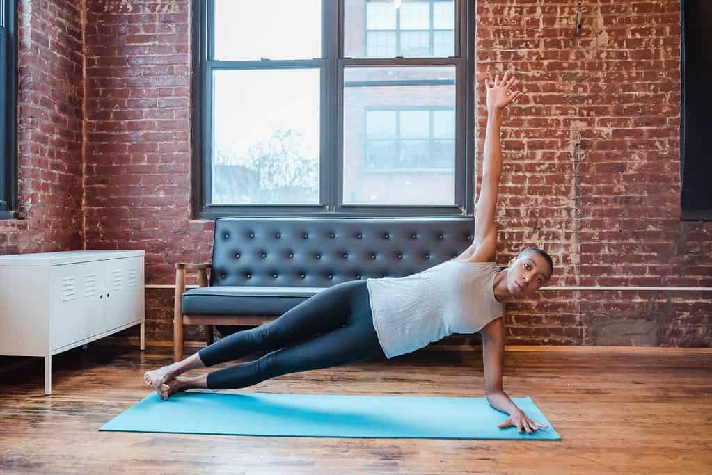 Female performing side plank