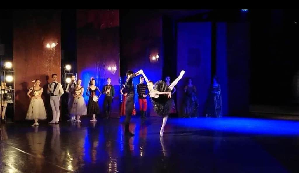 Odile on centre stage during swan lake ballet performance