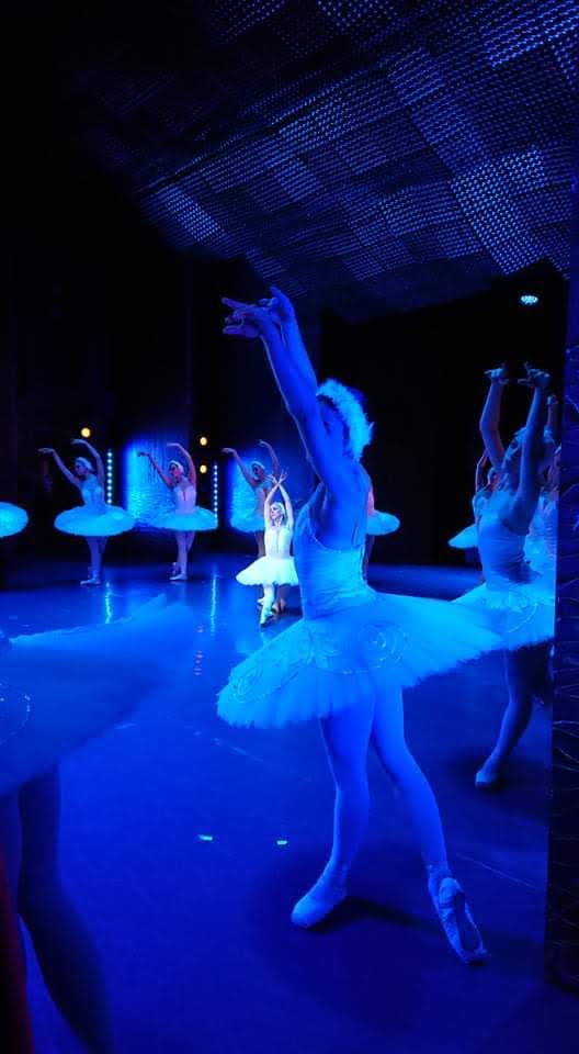 Odette centre stage during swan lake ballet performance