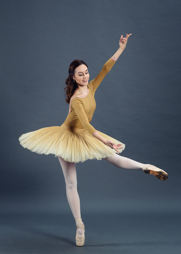 Audition photo of Ada Gonzalez in a mustard tutu