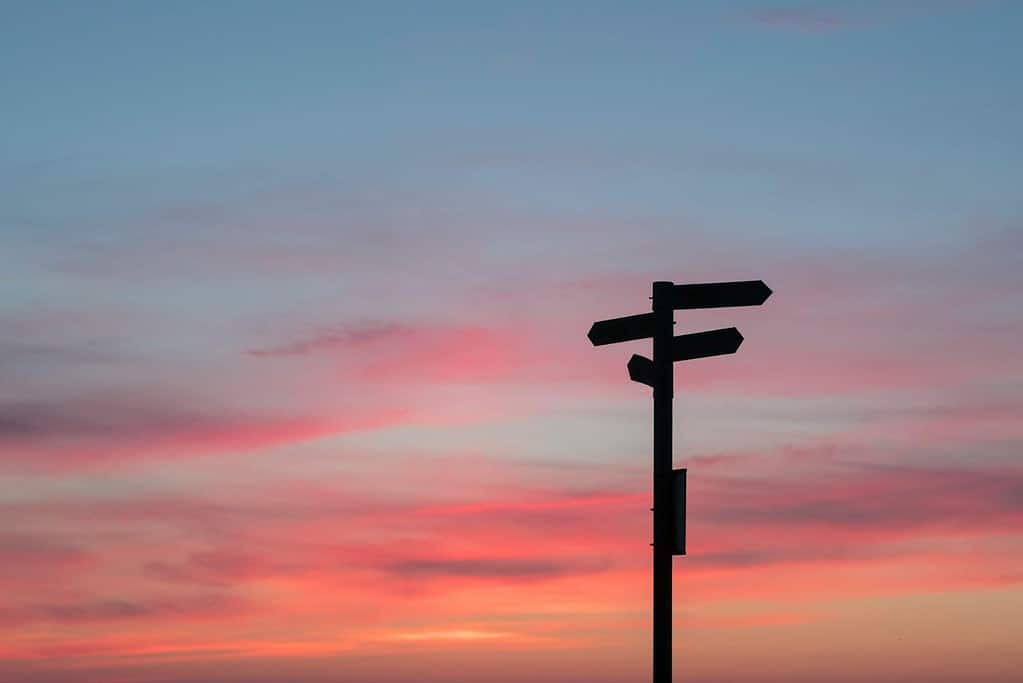 Street sign with a sunset backdrop