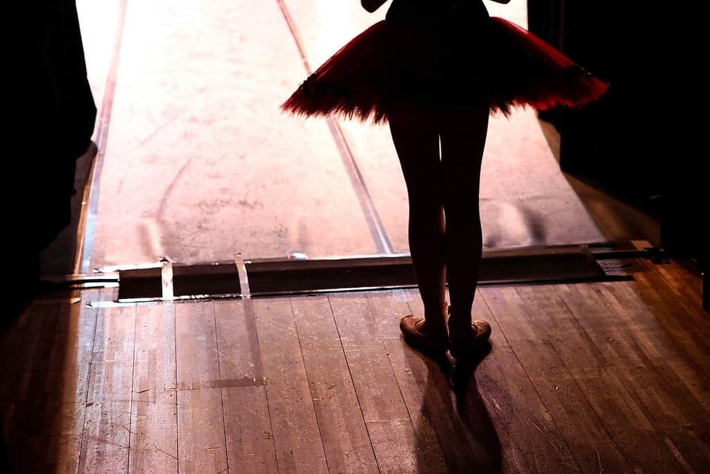 Dancer ready to enter on stage wearing a ballet tutu