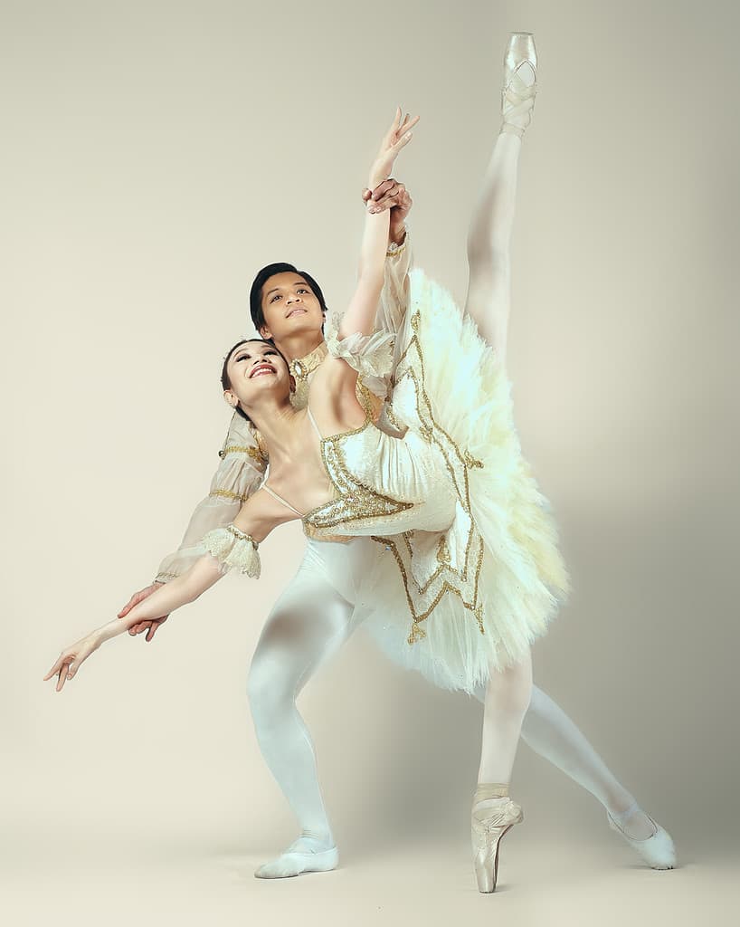 Professional ballet dancer Abigail Oliveiro dancing with male partner in white costume