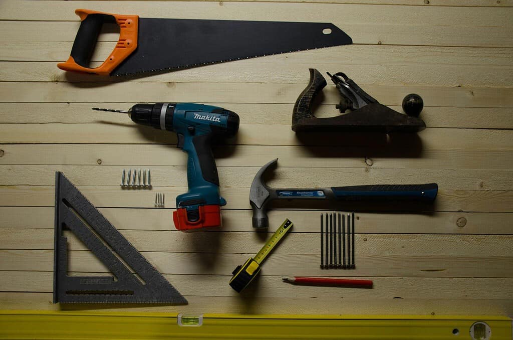 Variety of hardware tools against a toolboard