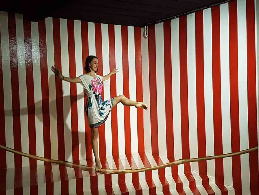 Professional dancer Brittany Haws performing a ballet attitude on a tight rope