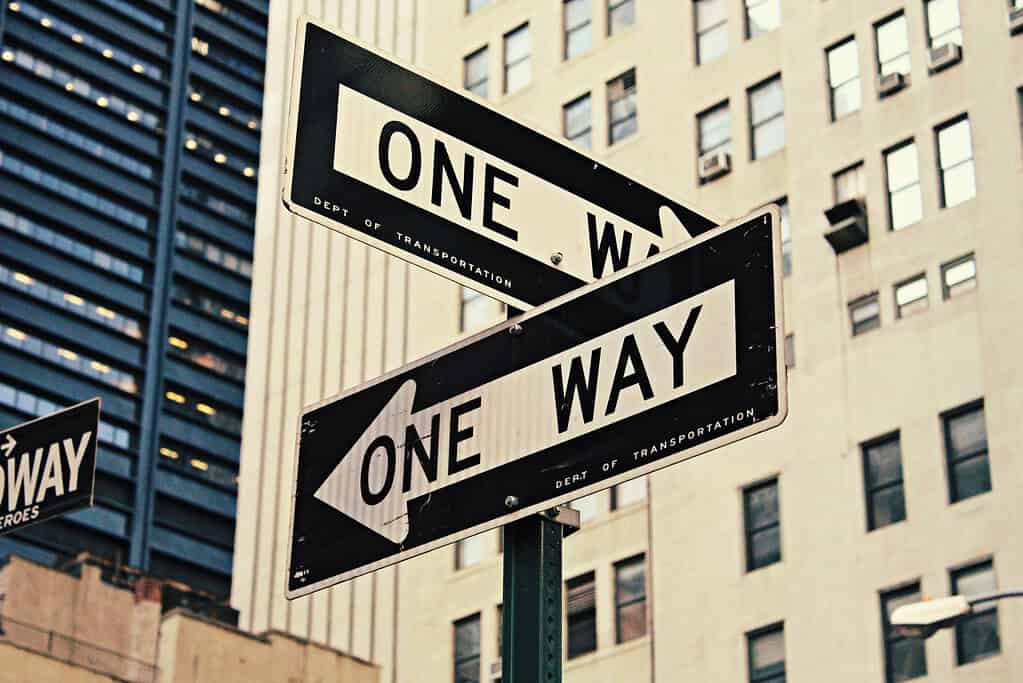 One way street signs pointing in opposite directions