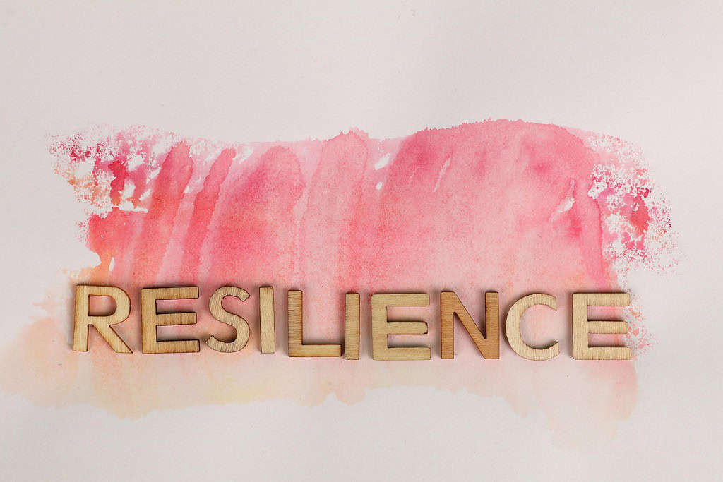 Resilience sign against pink backdrop