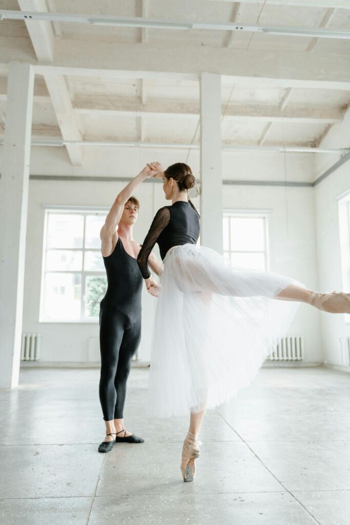 Male and female ballet dancers working on their artistry