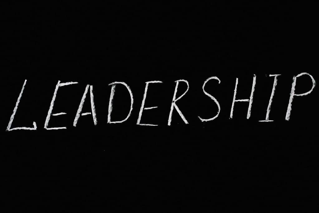 Black and white leadership sign