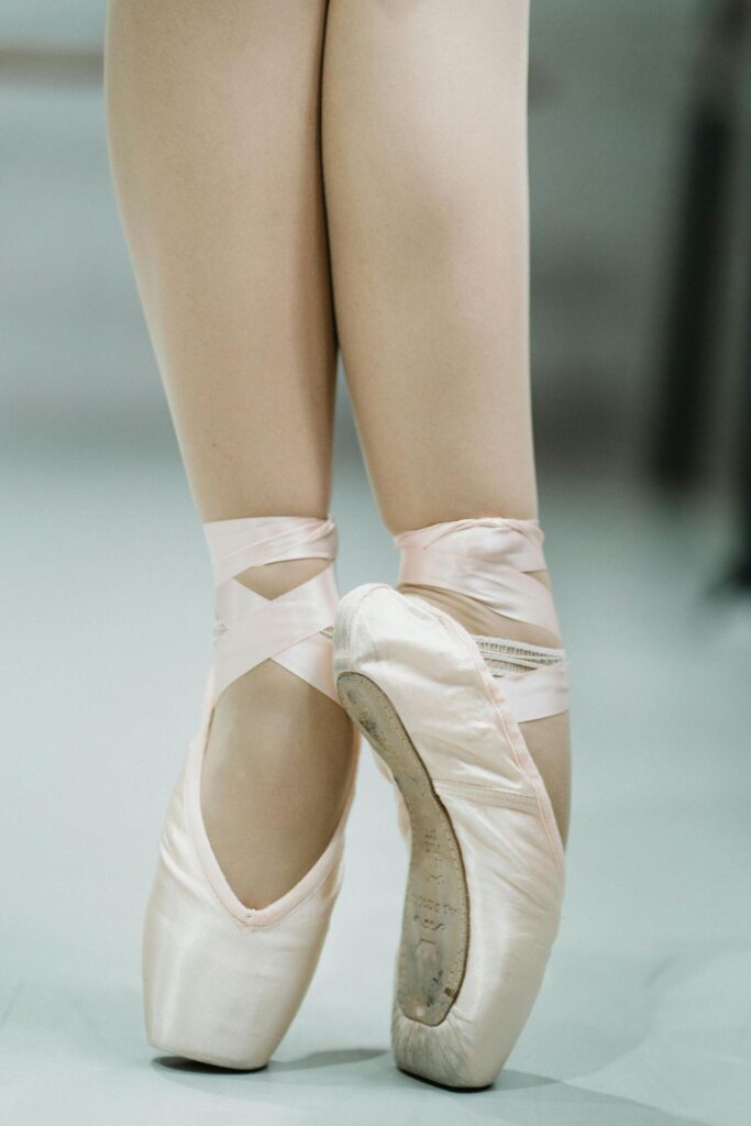 Dancer rising on pointe shoes