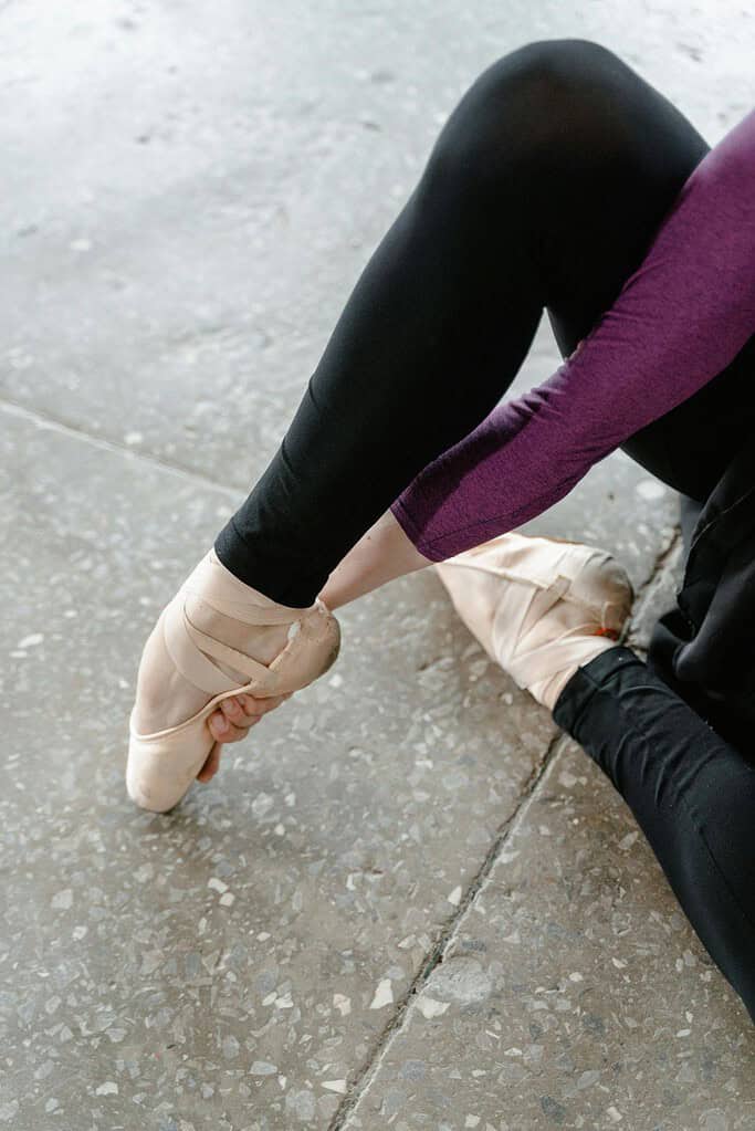 Dancer breaking in pointe shoes