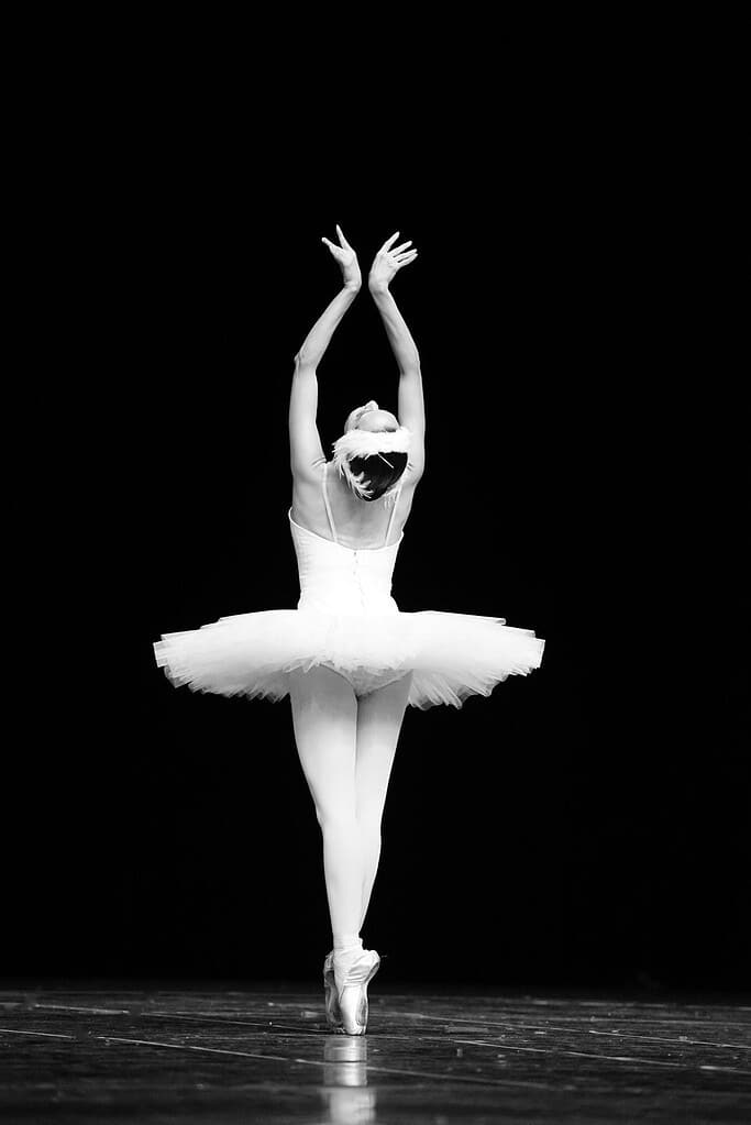 Ballerina on stage dancing in Swan Lake