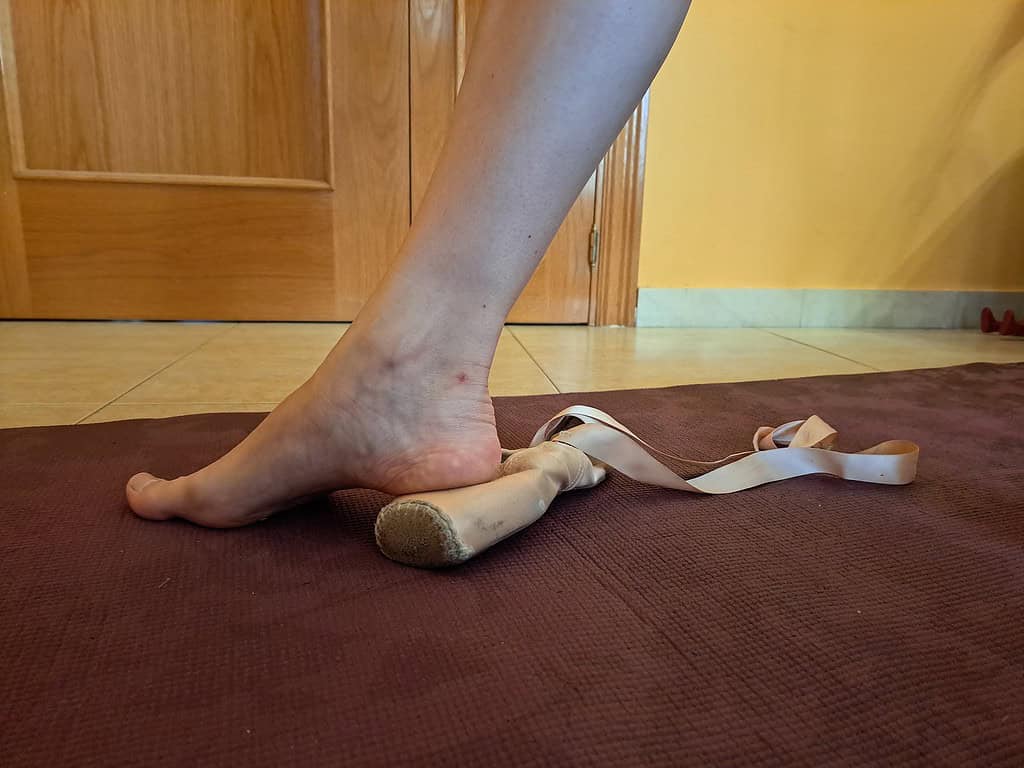 Dancer standing on the box of her pointe shoe