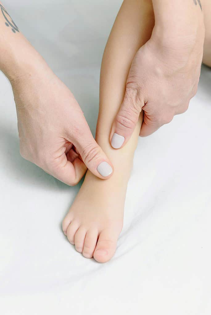 Small dancer foot being massaged