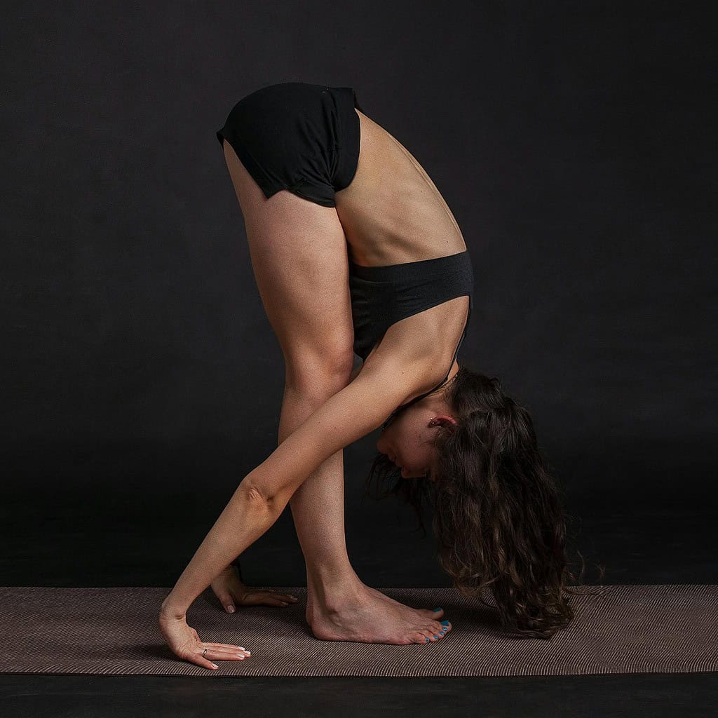 Dancer doing some gentle stretching in the ballet off-season