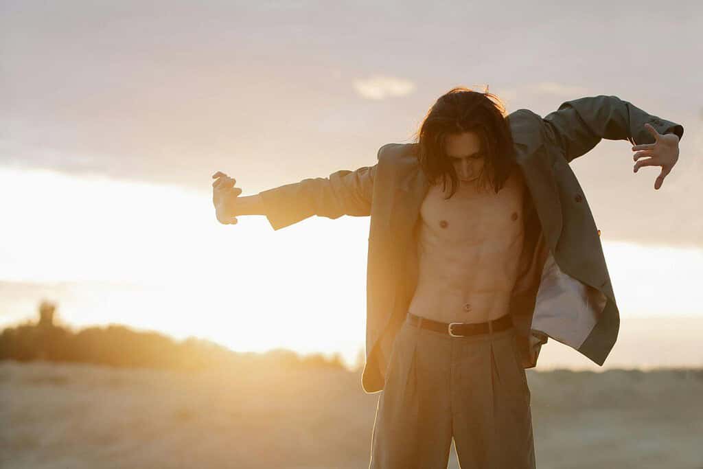 Male ballet dancer working on character portrayal outside