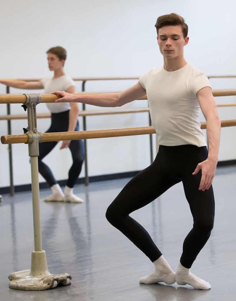 Male ballet performing a ballet plie