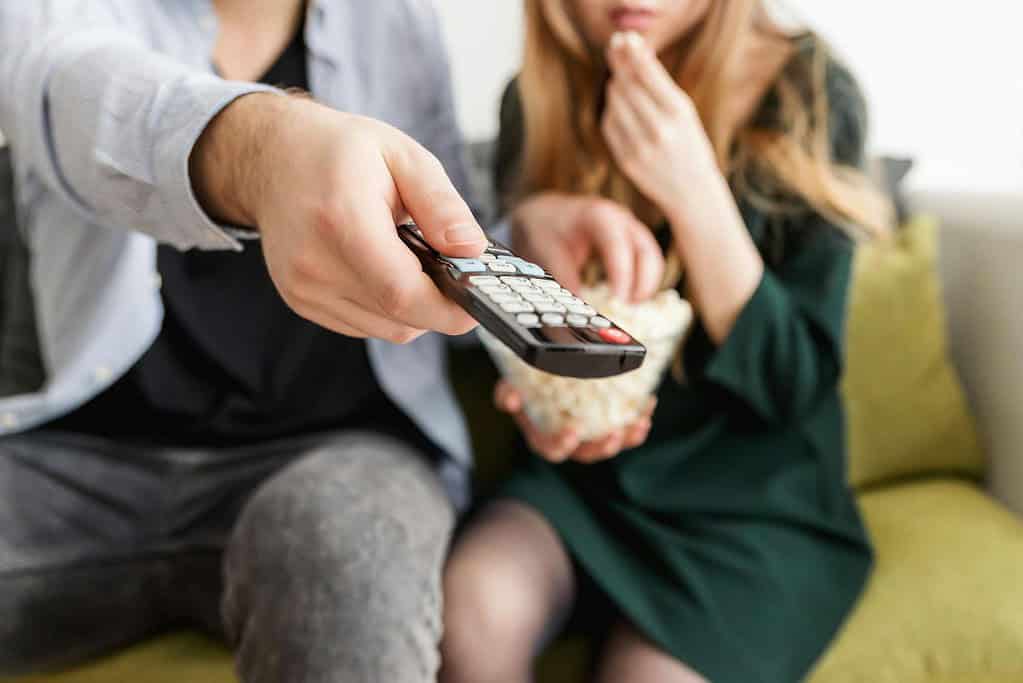 Couple watching a movie with popcorn