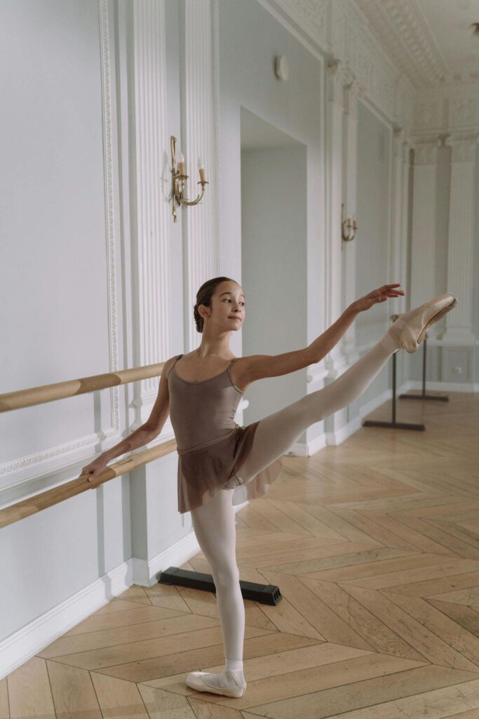 Dancer showing ballet turnout at the barre