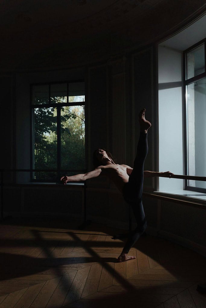 Male dancer practising at the barre