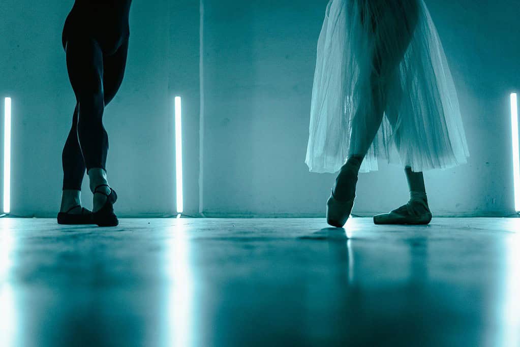 Male and female dance practising their dance routine