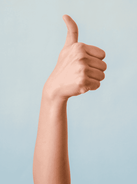 Hand showing a positive thumbs up