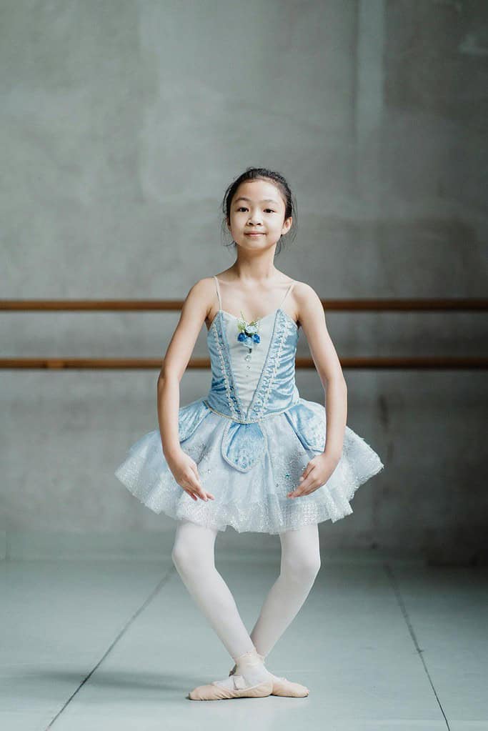 Young dancer performing a ballet plie