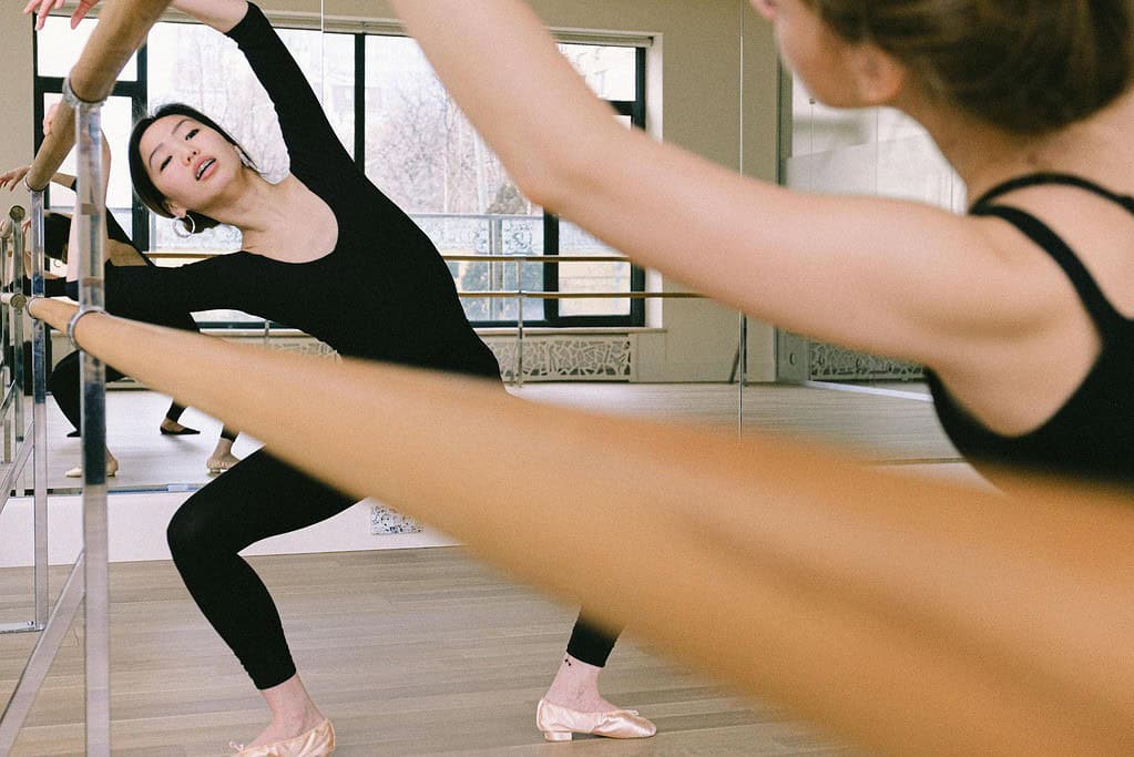 Ballet plie at the barre